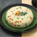 Delicious Multi Millet Upma with veggies, cashews, and green leaf plate thumbnail
