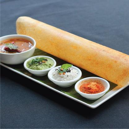 Multi Millet Dosa with variety of chutneys on a plate for a wholesome meal