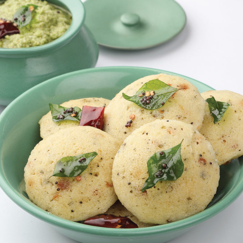 Ready-to-eat Millet Rava Idli served in a green bowl
